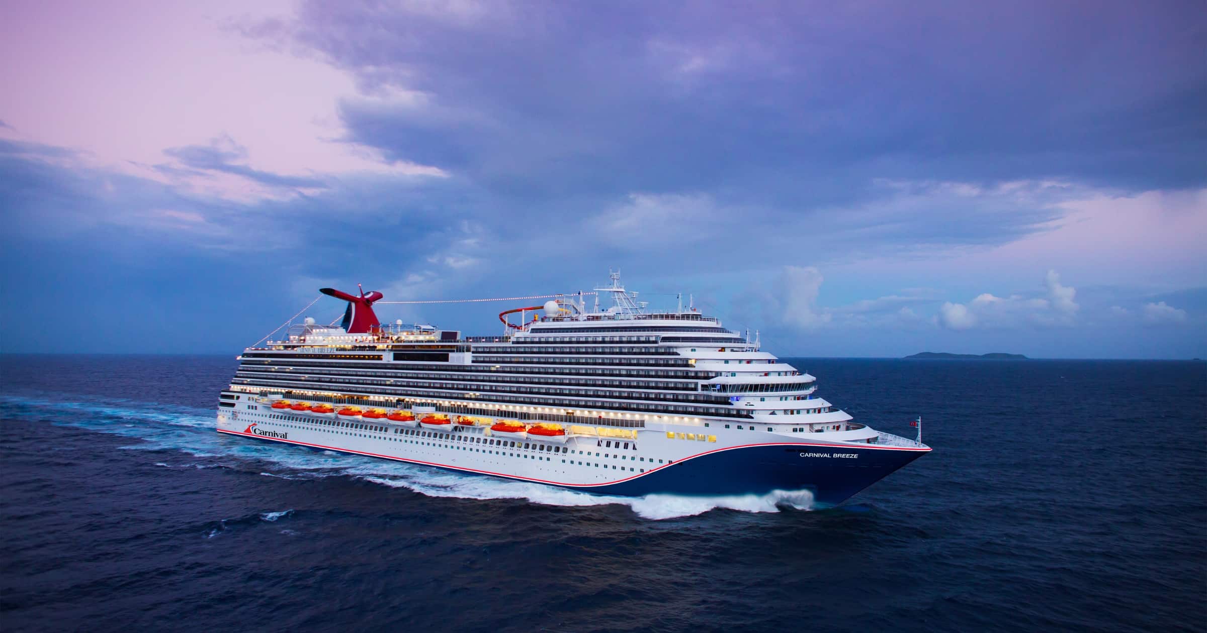 Carnival Breeze sailing at sea with evening sky